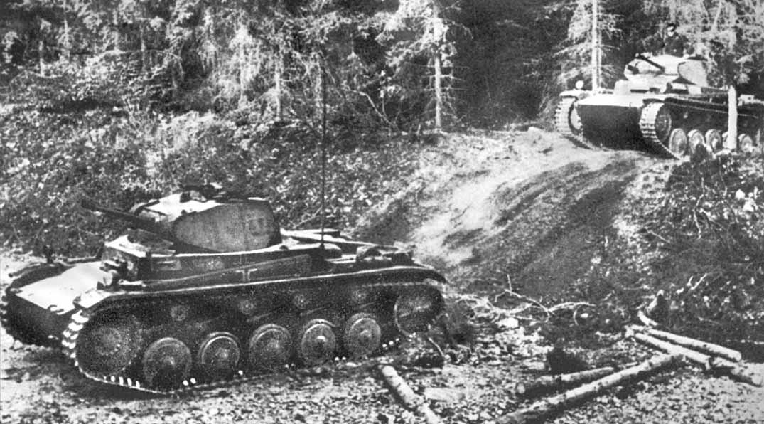 Armour halted on a forest track in the Ardennes — the terrain the French believed impassable to tanks.